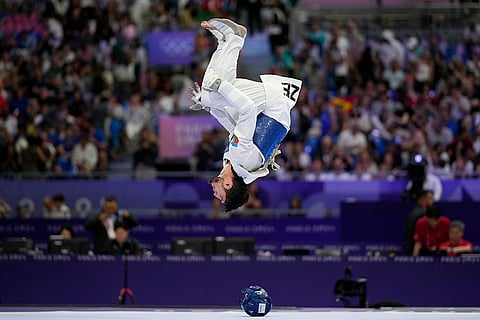 Azerbaijan's Gashim Magomedov reacts after winning men's 58kg Taekwondo semifinal